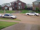 Water from a heavy rainstorm rises on my street.